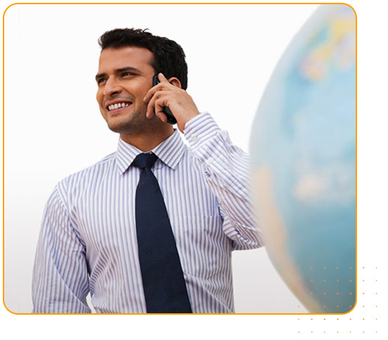A man calling infront of globe